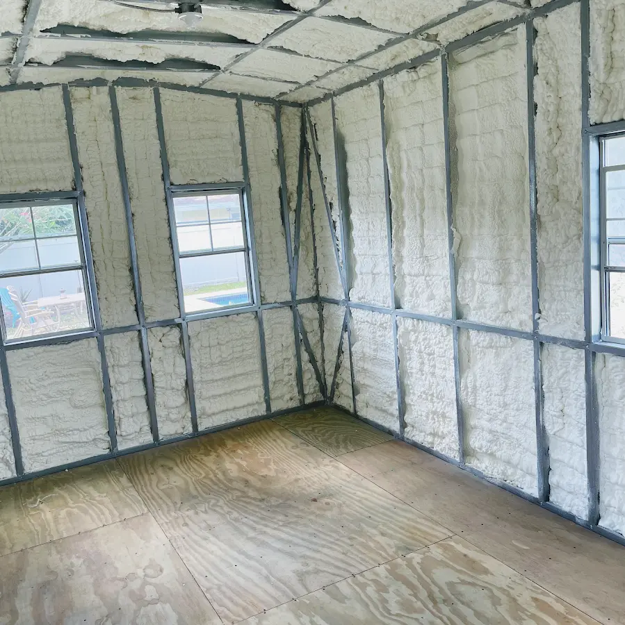 Closed-cell spray foam insulation applied to wall cavities in a residential project in Logansport